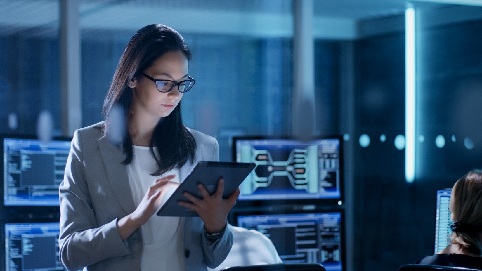 Woman working on a tablet.